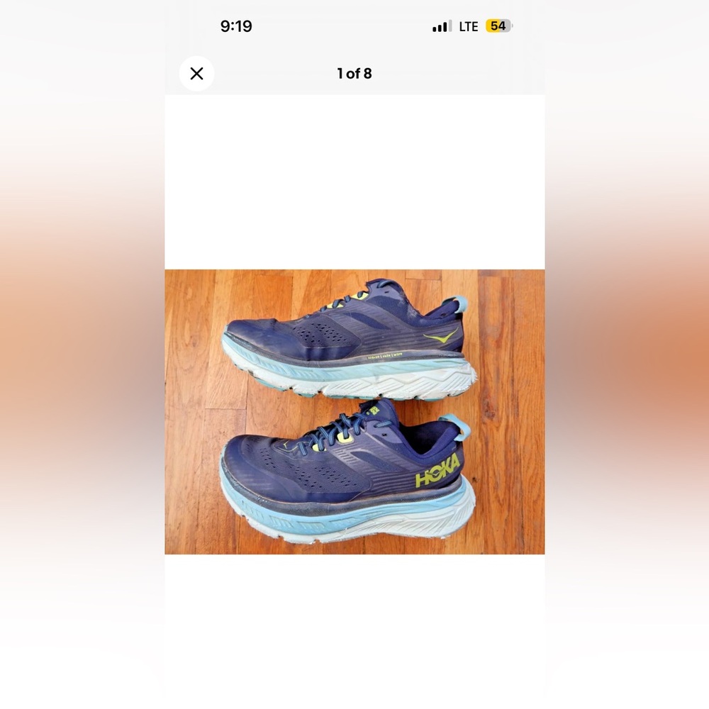 Hoka woman’s athletic running or walking shoes